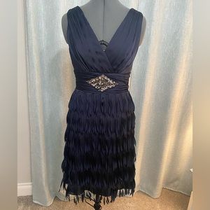 Cocktail dress. Size-8, fits smaller figures to a size 6. Navy Blue.